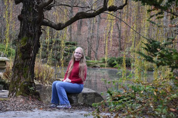 me sitting on a rock at Gibbs Gardens